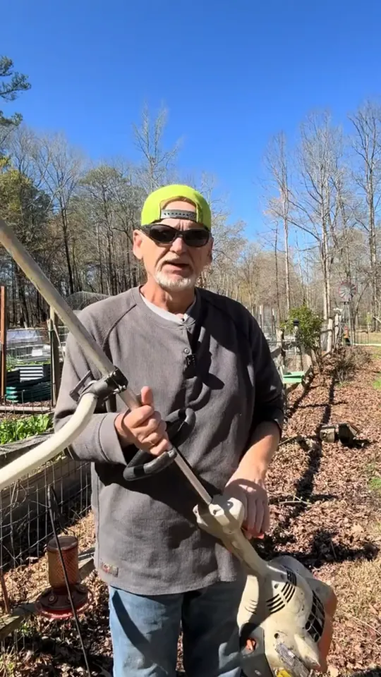 A customer demonstrating the raised grip position on his own trimmer